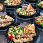 Greek salad with chicken and pita bread